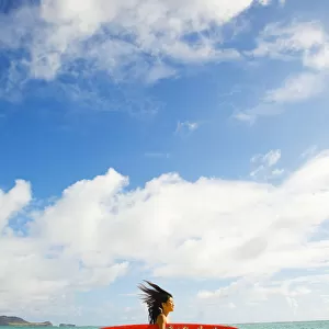 Hawaii, Oahu, Lanikai, Young Japanese Woman Running On Beach While Holding A Red Surfboard