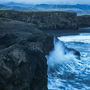 Large Waves Splash Against The Cliff Sides Of Dryholaey, Southern Iceland; Iceland