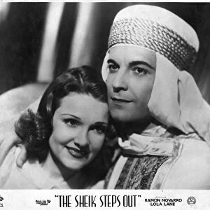 Movie photograph. The Sheik Steps Out is a 1937 American musical film directed by Irving Pichel and written by Adele Buffington and Gordon Kahn. The film stars Ramon Novarro, Lola Lane, Gene Lockhart, Kathleen Burke, Stanley Fields and Billy Bevan