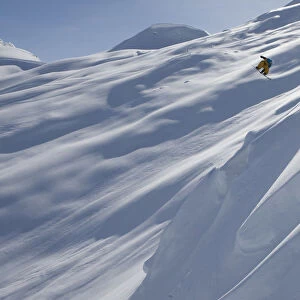 Professional Snowboarder, Frederik Kalbermatten, Heli Boarding In The Mountains Above Haines, Southeast Alaska
