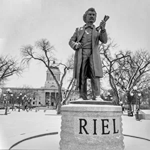 Statue of Louis Riel in front of the Manitoba Legislative Building in winter; Statue of Louis Riel, Manitoba Legislative Building, Winnipeg, Manitoba, Canada