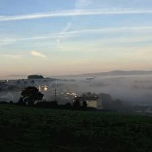 View Of A City Through The Fog; Tipperary, Ireland