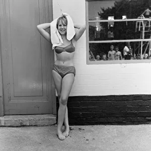 18 year old Christine Collman of Roehampton, a young model at a pool. 12th August 1965