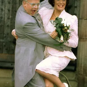 Actors Ken Morley and Sherrie Hewson as Reg Holdsworth and Maureen Naylor getting married