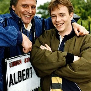 Adam Woodyatt who stars in Eastenders as Ian Beale, poses beside an Albert Square street