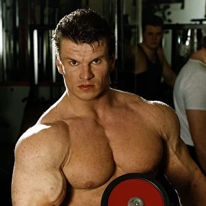 Alex Georghev one off the TV Gladiators Hawk seen in the fitness gym lifting a bar bell