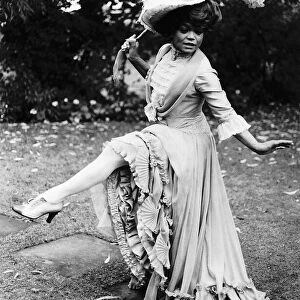 American singer and actress Eartha Kitt dressed up for her role in the English play The
