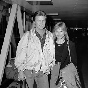 American singer and film actor Rick Nelson accompanied by his girlfriend Helen Blair