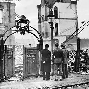 American soldiers looking at a wrecked school in Sandhurst Road, London