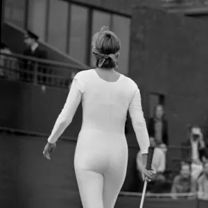 American tennis player Anne White in action wearing her white skin tight catsuit during