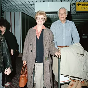 Angela Lansbury and husband Peter Shaw at London Airport. 13th March 1990