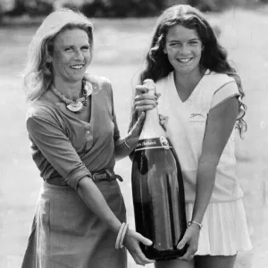 Annabel Croft and her mother Susan carrying a Salmanazar of champagne (same as 12 bottles