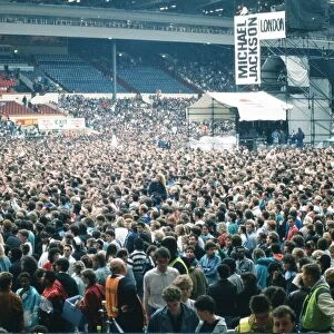 Audience gather outside the Wembley arena prior to the Michael Jackson concert
