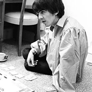August 1964 George Harrison playing Monopoly at Bel Air home with Jackie De Shannon