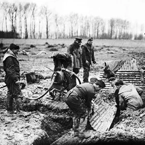 B Company Royal Irish Fusiliers constructing trenches with corrigated iron