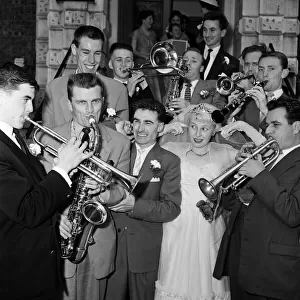Bandleader Roy Kenton, 25, marries 18-year-old singer of the band Jean Barry at St