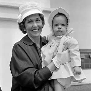 Barbara Riese, (wife of tennis player Fred Perry) pictured with their daughter Penny who