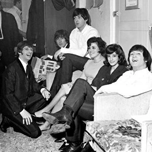 The Beatles with two american fans who flew to London to see Another Beatles christmas