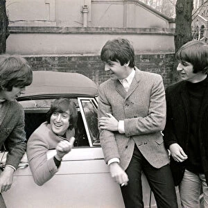 The Beatles by John Lennons car after he passed his L-test 15th february 1965