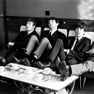 The Beatles relax during rehearsals at The Prince of Wales Theatre in London for The