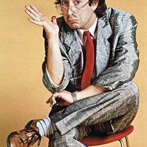 Ben Elton comedian sitting hunched over A©mirrorpix