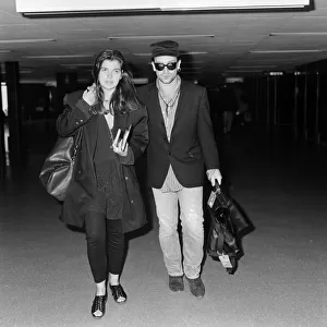 Bono of rock group U2 and his wife Ali pictured at London Airport. 16th July 1987