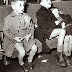 Boys watchh the western at the Saturday morning cinema club, circa 1950