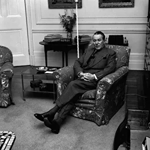 British author Dennis Wheatley poses for portraits in his home. 7th January 1964