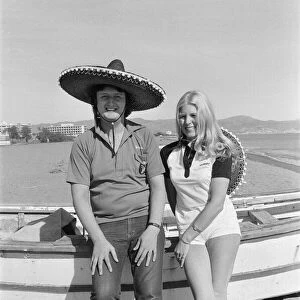 British darts player Eric Bristow poses with Maureen Flowers on the beach at Torremolinos