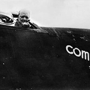British Prime Minister Winston Churchill looks out from his personal aircraft
