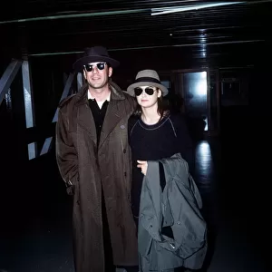 Bruce Willis with wife Demi Moore arriving at London Airport October 1987