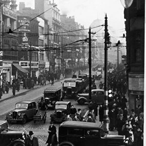 A busy Market Street, Manchester seen here in the 1930s