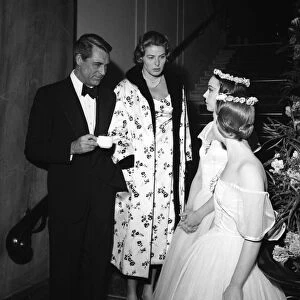 Cary Grant and Ingrid Bergman chat to two dancers between takes filming Indiscreet at