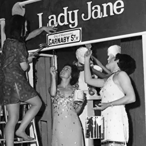 Three charming girls giving a Carnaby St. look to the decor