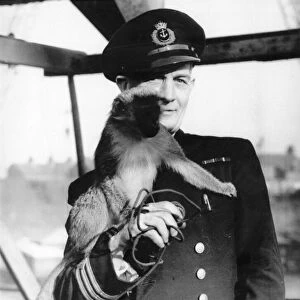 Chief Officer J Stevens and his monkey Jennie, aboard The Father Neptune