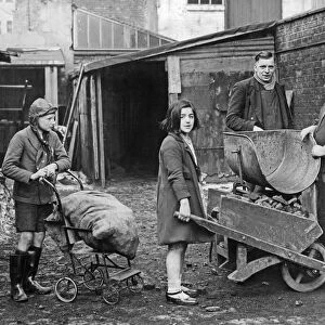 Children collecting their coal ration from a coal merchant near Birmingham City centre