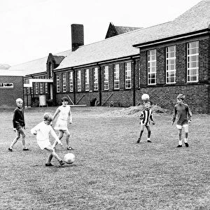 Children of Cragside Junior School go through their repertoire of soccer skills, 1969