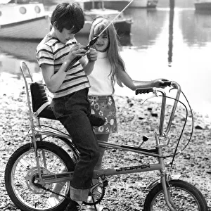 Children playing in the 1970s on a chopper bicycle bike