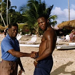 Chris Eubank Boxing shaking hands with man on beach