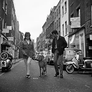 Christina Spooner and singer Tom Jones with Cheetah Kinna walk down Carnaby Street to