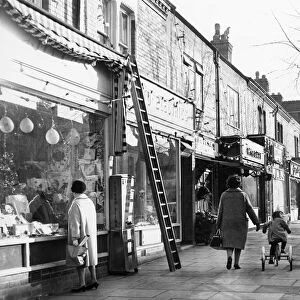 Christmas lights go up at the parade of shops on Allandale Road, Leicester