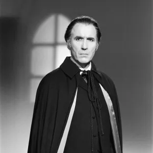 Christopher Lee, being photographed for poster, dressed as character Dracula in film