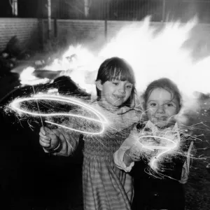 Clare aged 6 and Lindsay Gerard aged four (right) enjoying their sparklers at an