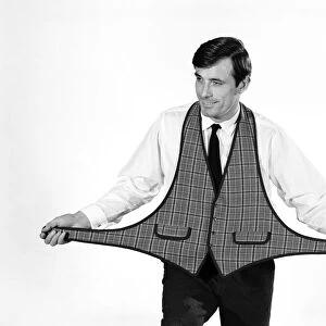 Clothing: Fashion: Menswear: Peter Anthony modelling waistcoat. 1964 B1709-003