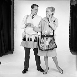 Clothing: Man and woman wearing matching aprons. 1960 B1255-002