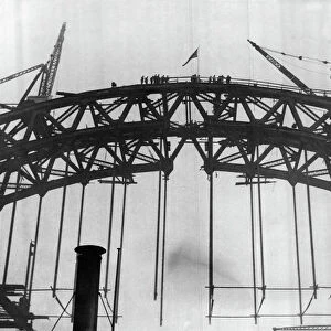 Construction of the new Tyne Bridge. The Union Jack on the top after the joining up of