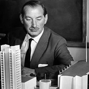The Coventry City Architect, Mr Arthur Ling, studies a model of his new design for