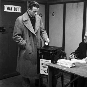 A Coventry voter casts his vote in the 1959 General Election at Cheylesmore polling