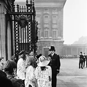 Crowd scenes outside Buckingham Palace, London, where The Beatles had their royal