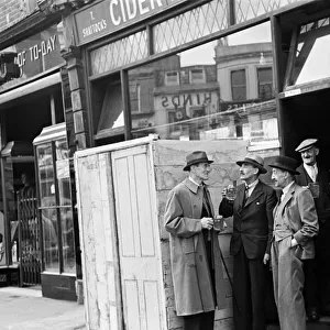 Customers and staff at the Cider House on Harrow Road, London. Circa 1946